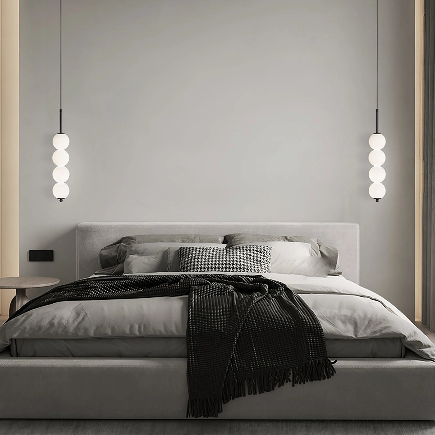 Symmetrical pair of four-orb Orbet pendant lamps in modern bedroom with large bed