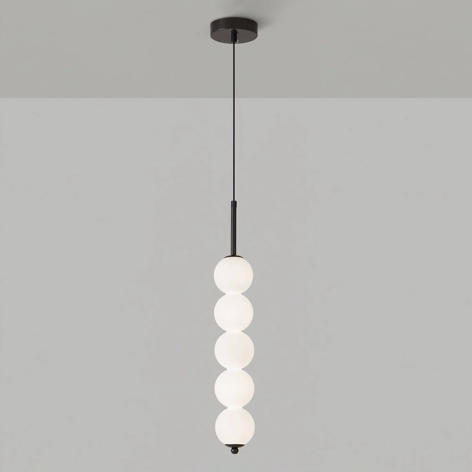 Five-orb Orbet pendant lamp in black finish kitchen island lighting application