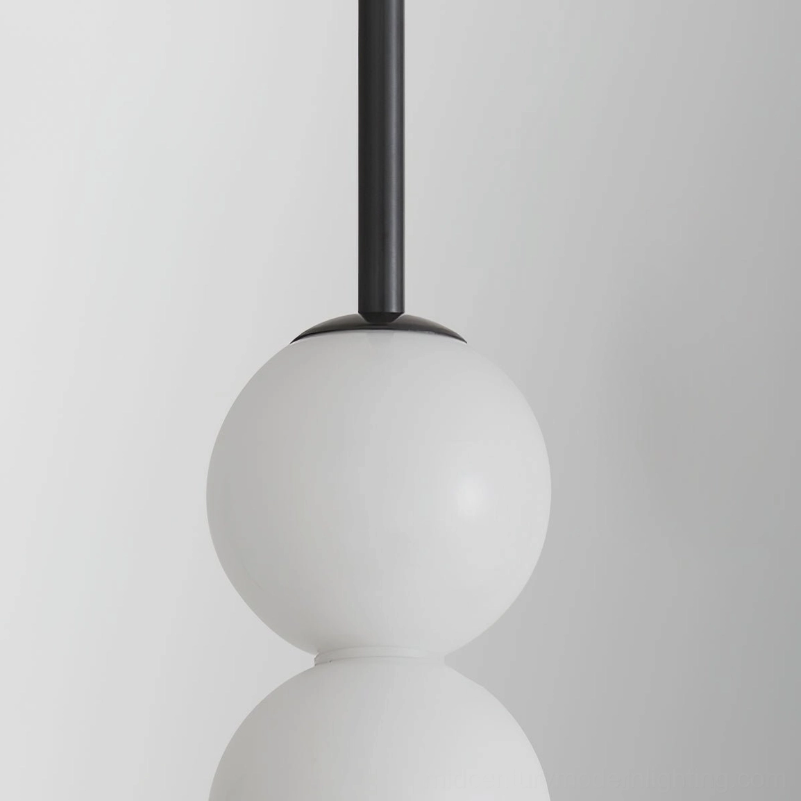 Five-orb Orbet pendant lamp in black hardware taller drop configuration