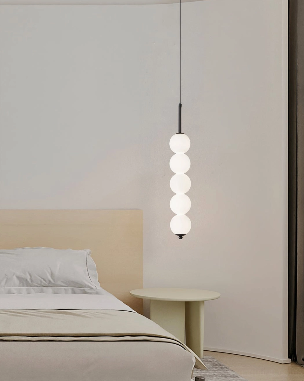 Five-orb Orbet pendant lamp with brass hardware in mid-height configuration