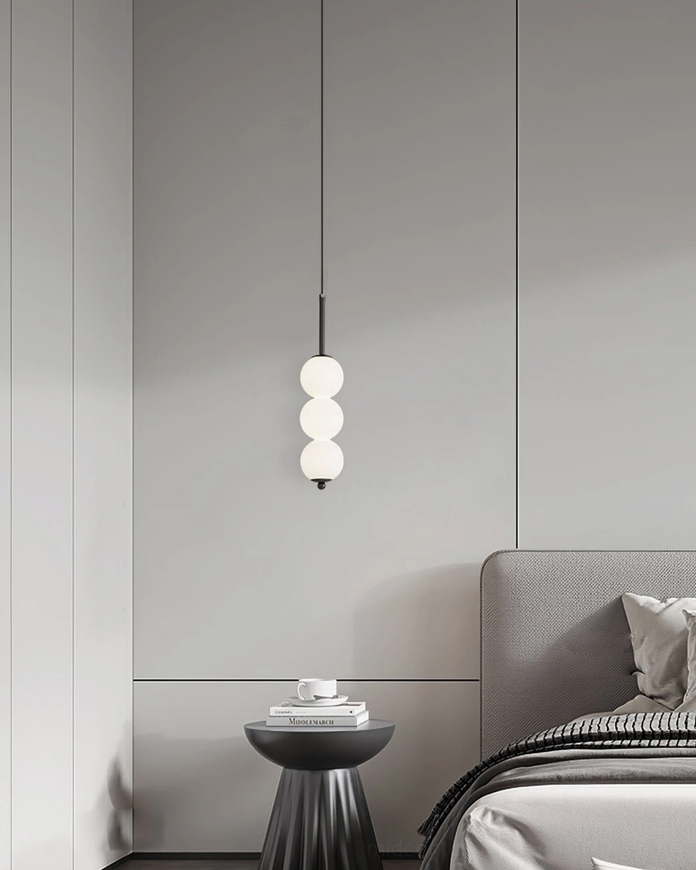 Orbet five-orb pendant lamp lighting display showing warm neutral light output