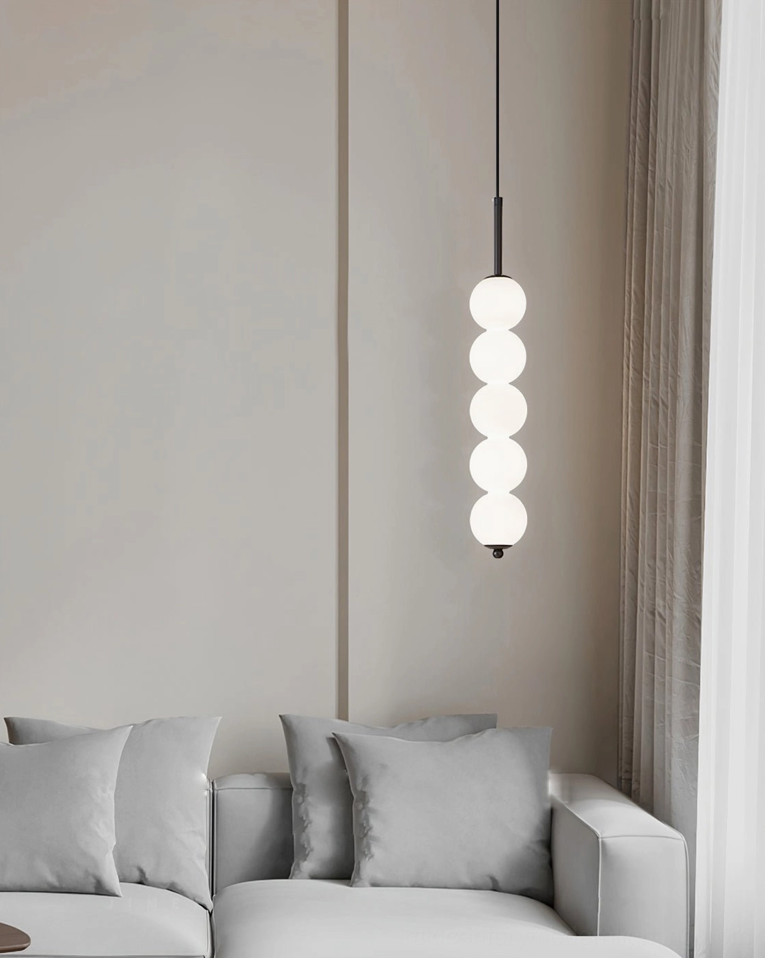 Orbet pendant lamp showing soft diffused milk glass glow when illuminated