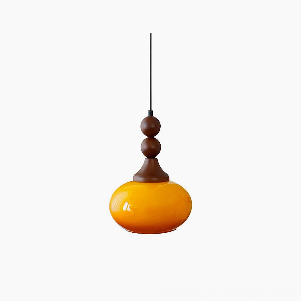 Orbique mid-century modern pendant light with amber glass shade and stacked walnut wood finial, studio overhead view