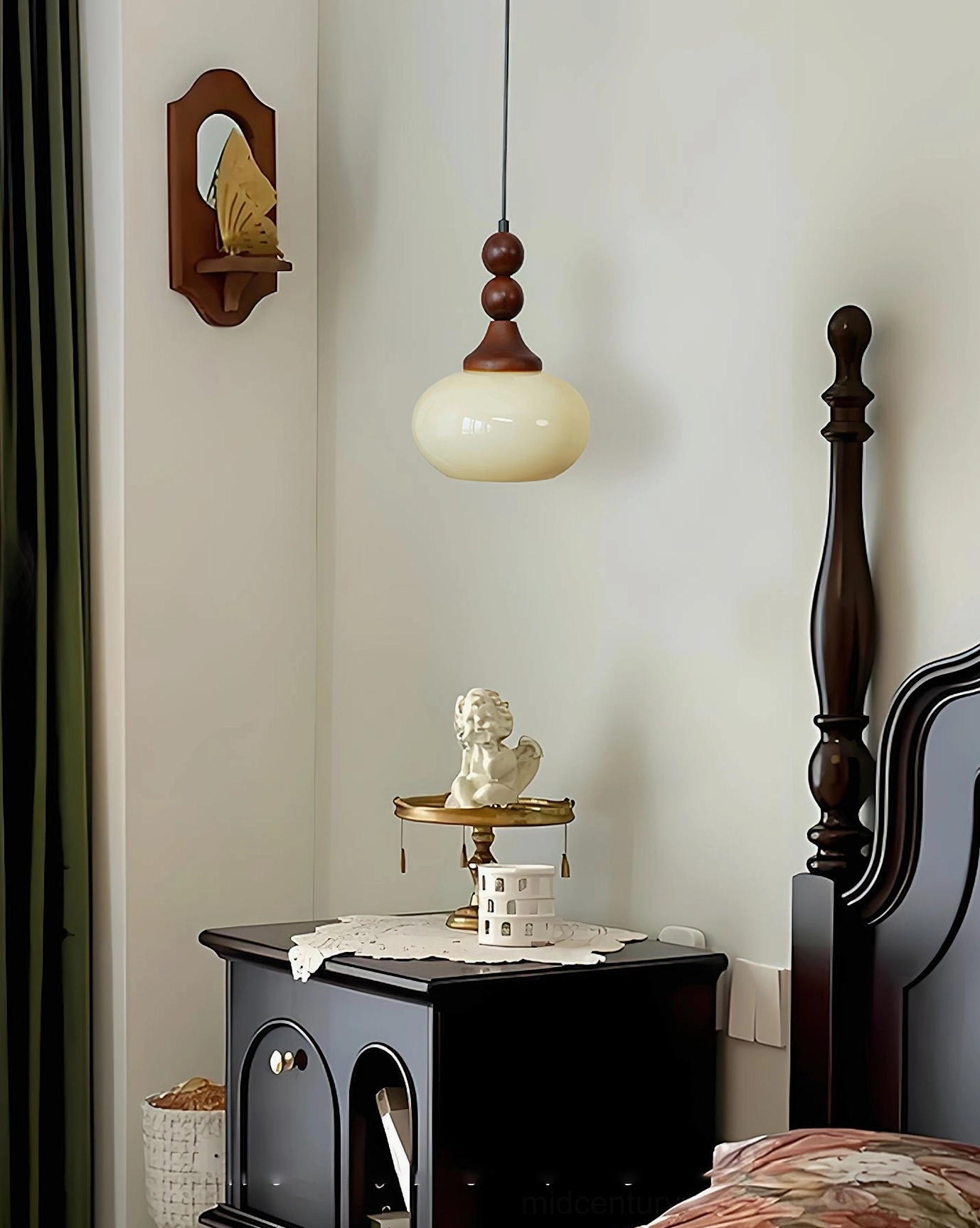 Orbique cream glass pendant light in classic bedroom with dark wood bed frame and wall-mounted mirror
