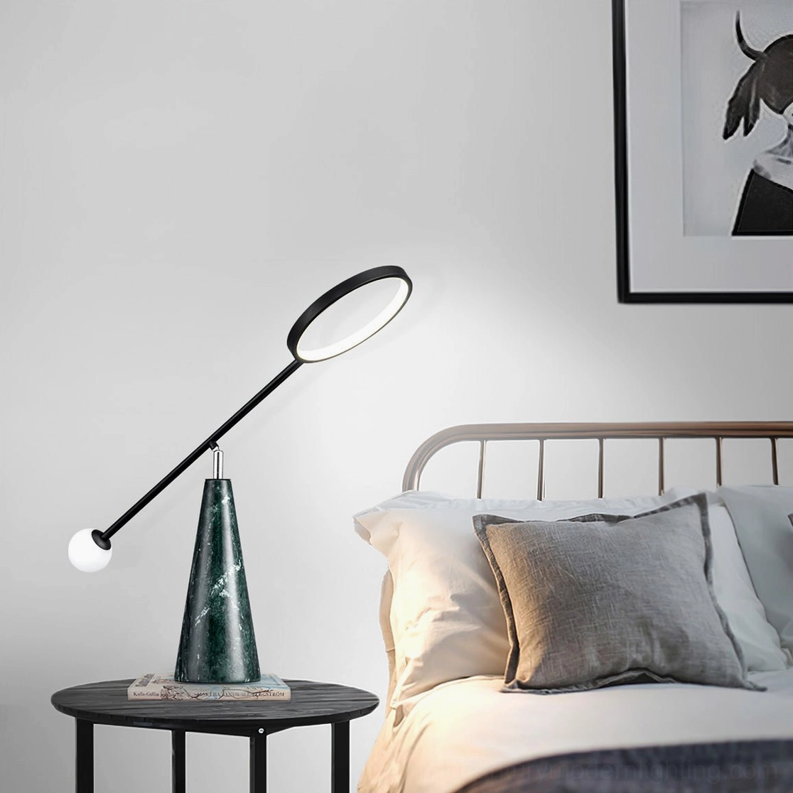 LED Orbit lamp positioned on bedroom nightstand beside metal bed frame with throw pillows