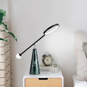 Modern Orbit table lamp in Nordic bedroom setting on minimalist bedside table with neutral decor