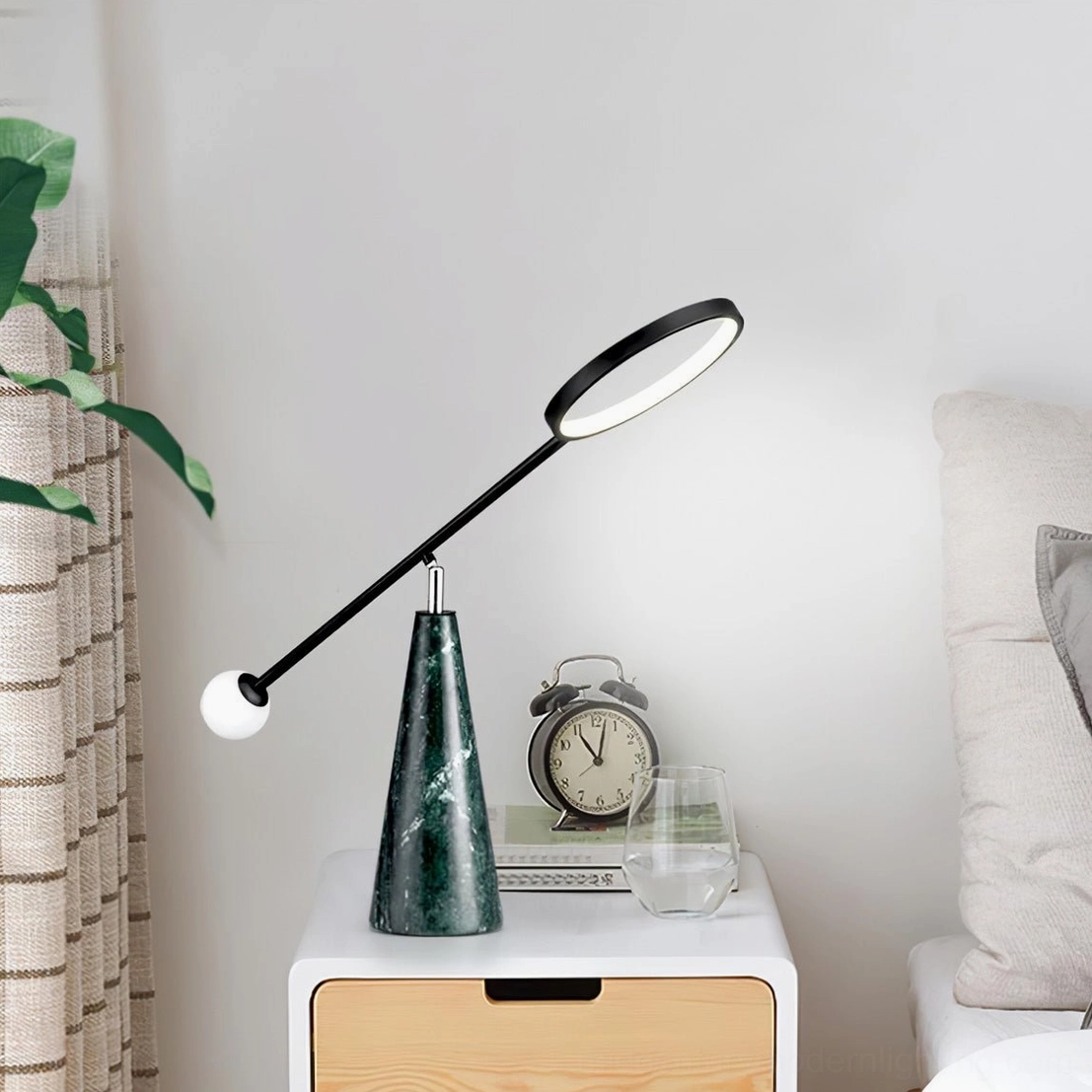 Modern Orbit table lamp in Nordic bedroom setting on minimalist bedside table with neutral decor