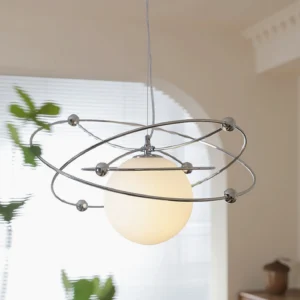 Mid-century modern orbital pendant lamp in cream dining room with natural light and window blinds