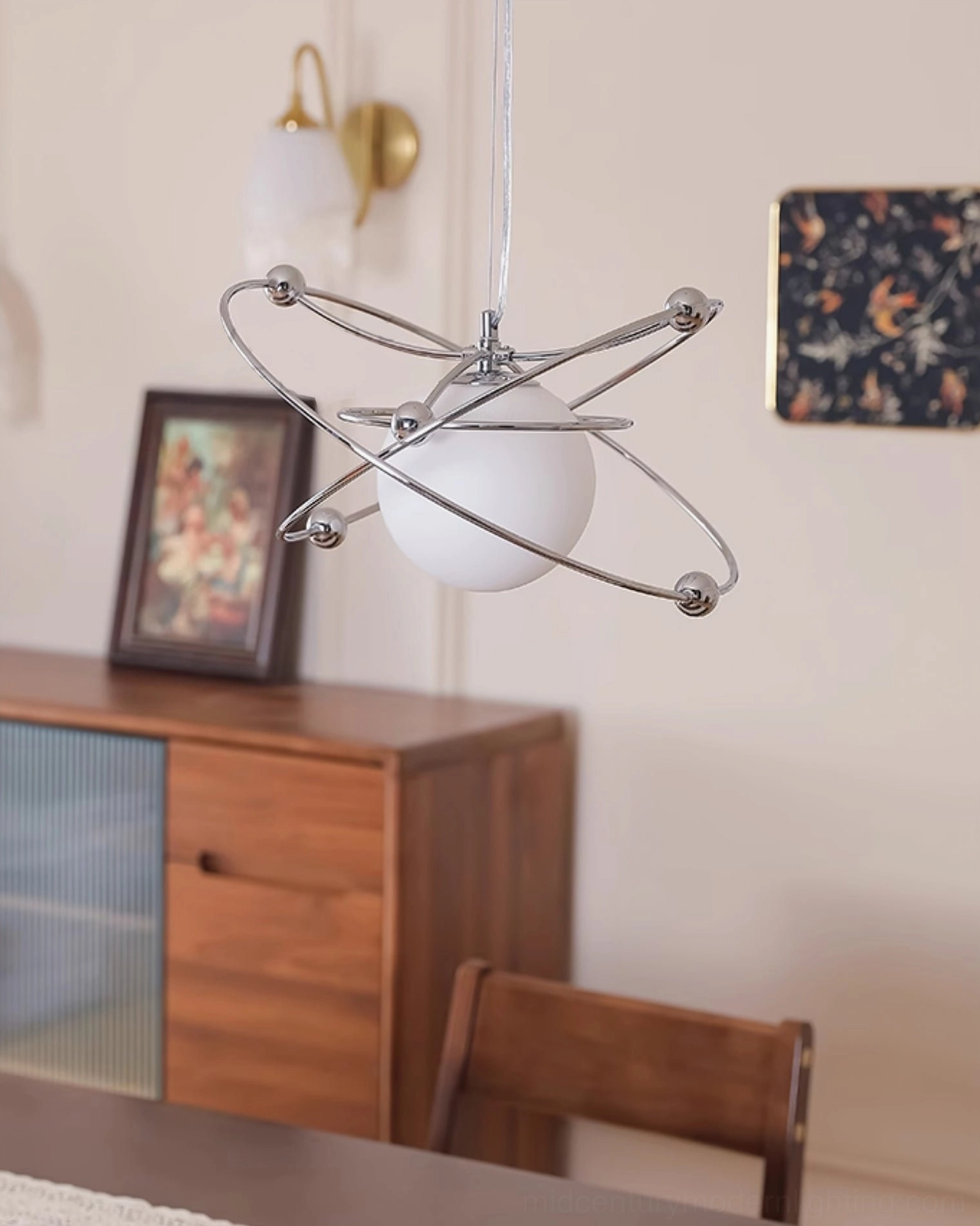 Retro orbital pendant light creating warm ambiance in dining room with wooden furniture