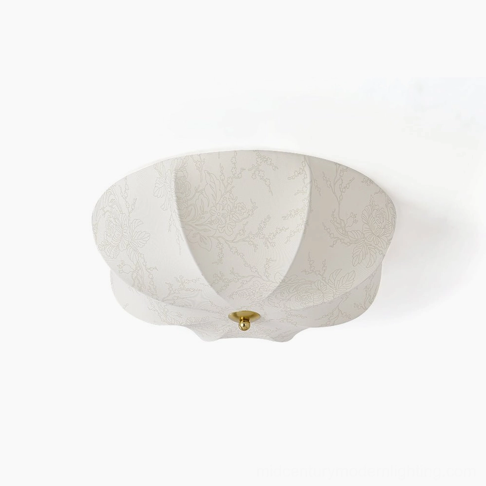 Orchid fabric ceiling light flat lay studio shot showing off-white scalloped shade with botanical floral print and brass metal base