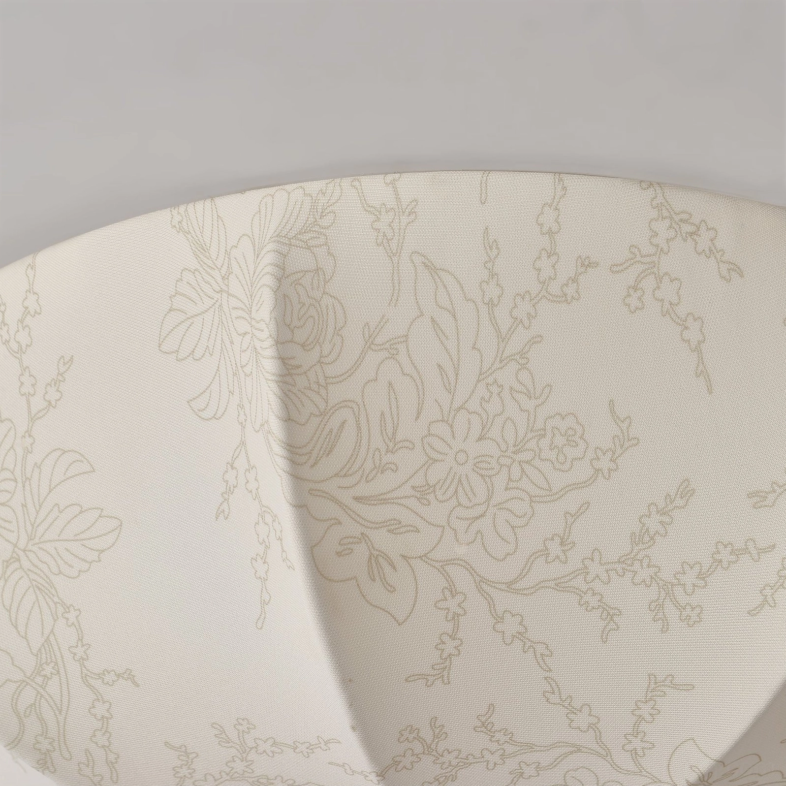Intricate orchid botanical line engraving on fabric lamp shade highlighting fine craftsmanship and texture detail