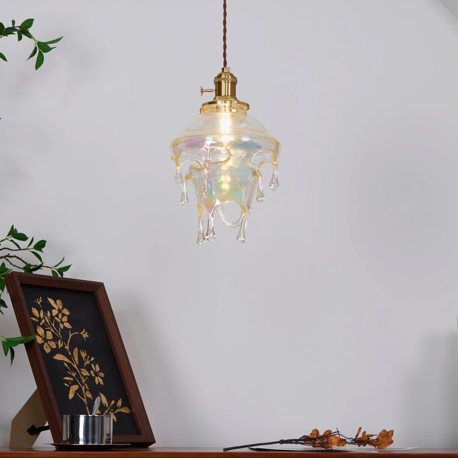 Handmade resin pendant showing organic melted drip texture and artisanal craftsmanship