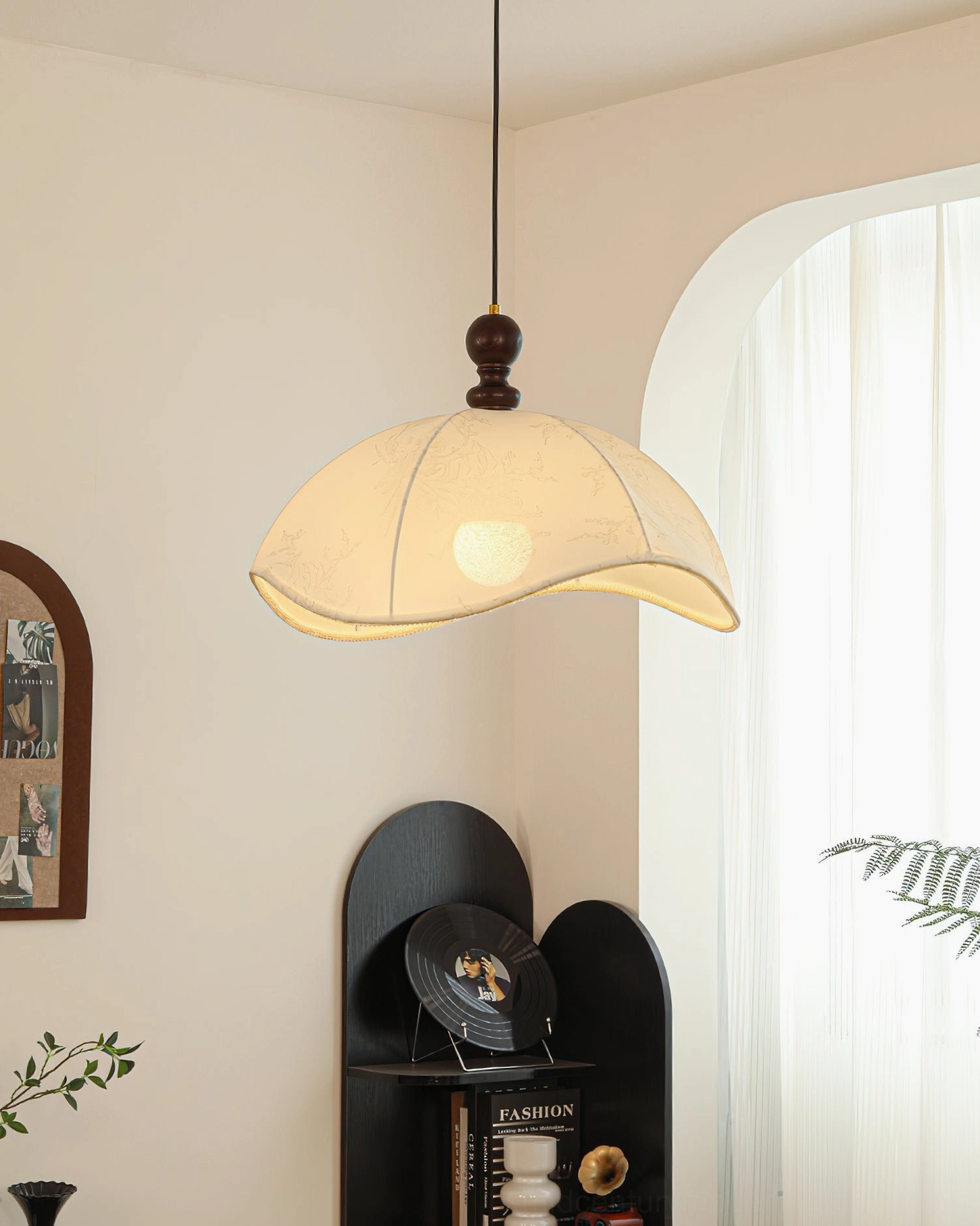 Oriente pendant light side view in minimalist warm French interior with arched window