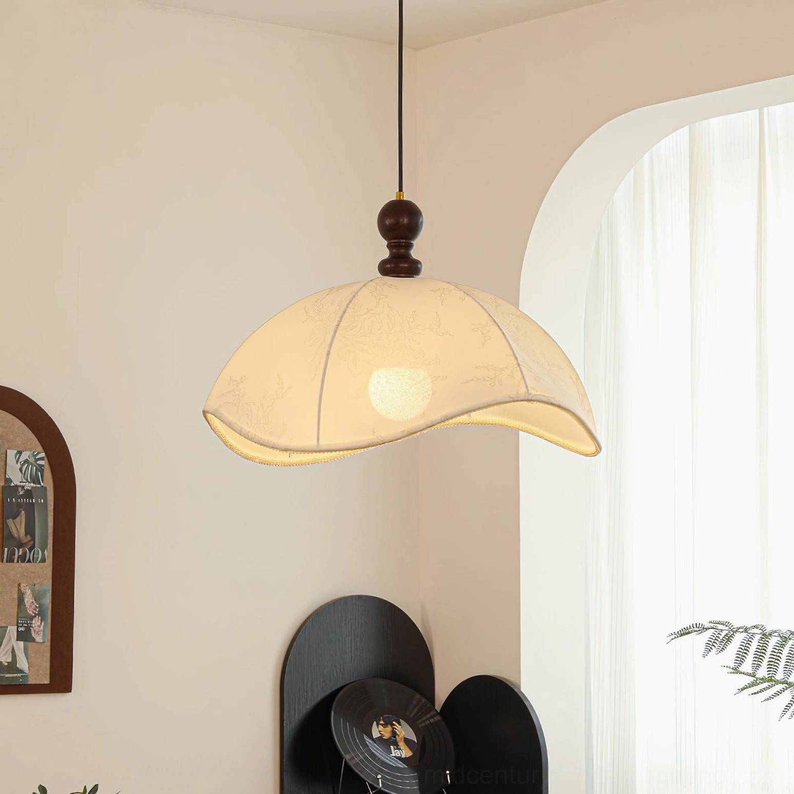 Oriente pendant light installed in French style interior with arched window, warm vintage aesthetic ambiance