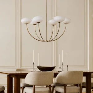 Orillia 6-light brass chandelier in luxury formal dining room with ambient lighting