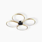 Orion four-leaf clover LED ceiling lamp with brass frame and white acrylic diffuser, front studio view, modern minimalist flush-mount fixture