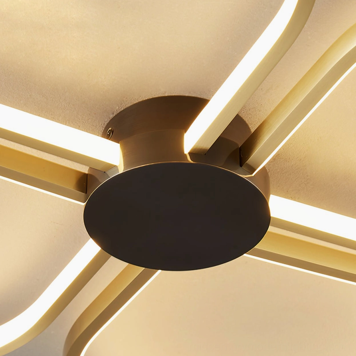 Close-up of Orion ceiling lamp matte black metal mounting hardware and brass support arms, overhead installation detail view