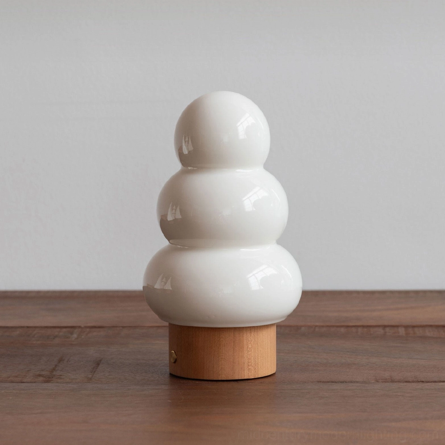 Orlo ceramic table lamp three-tiered glass diffuser architectural design feature close-up
