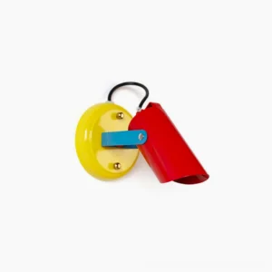 Orno mid-century modern wall lamp overhead flat lay view showing primary color geometric design with yellow base red shade and blue arm