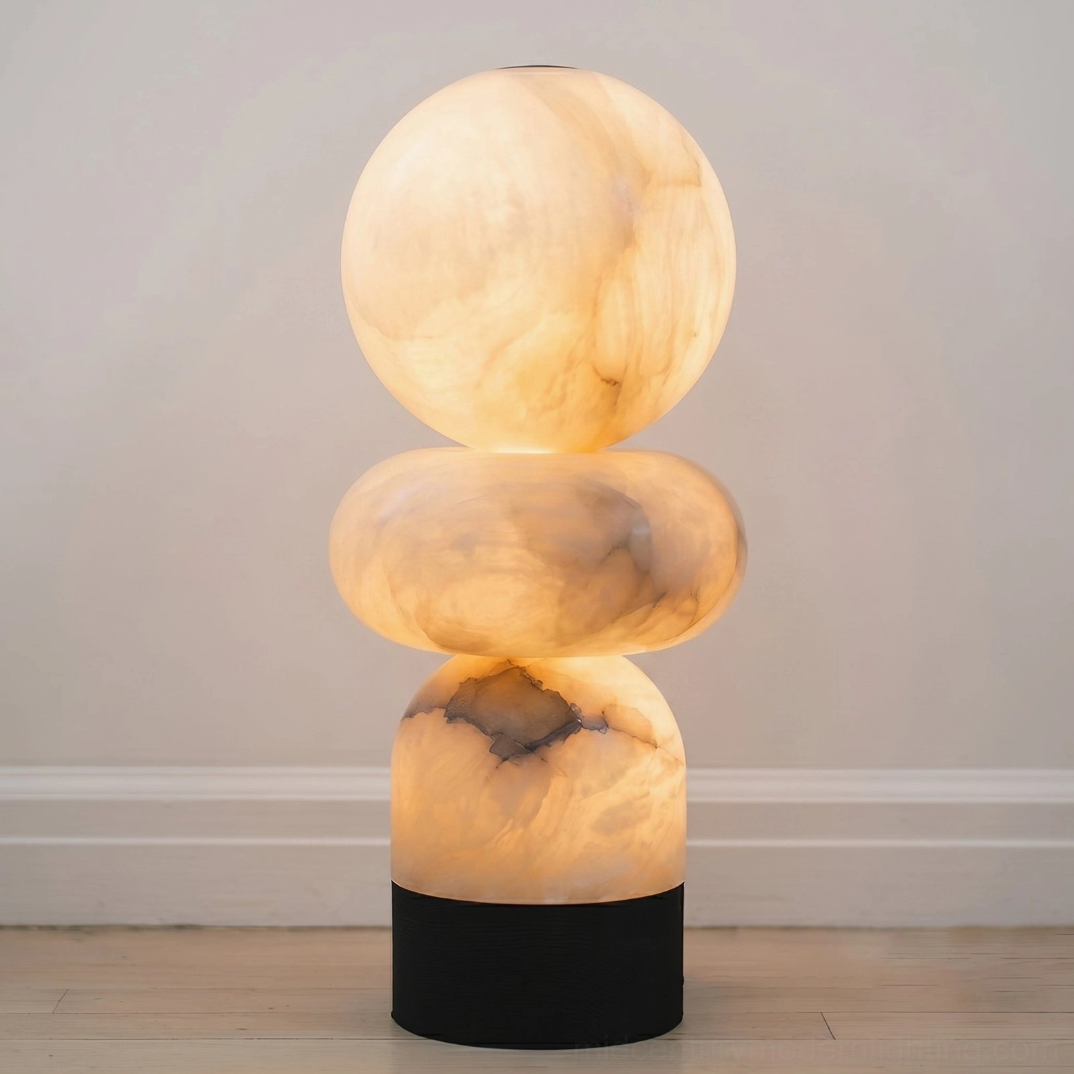 Orso natural alabaster stacked lamp lit with warm glow and visible stone texture