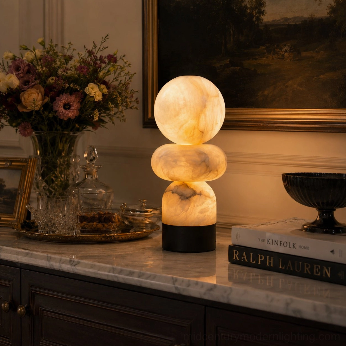 Orso alabaster lamp on marble top console cabinet with flowers and books styling