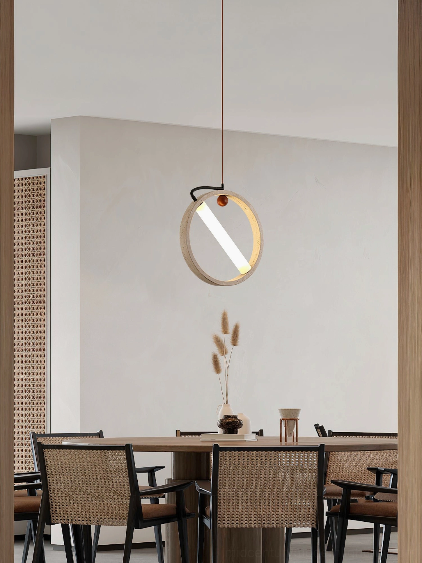 Orvion travertine pendant illuminating long wooden dining table in contemporary restaurant space