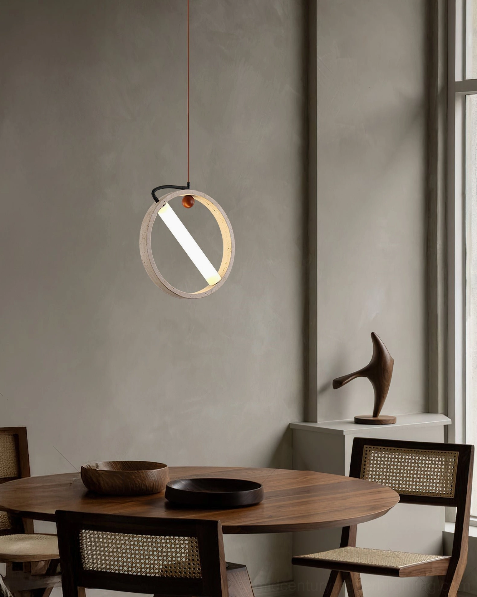 Orvion ring pendant light in warm wooden dining room creating sculptural architectural lighting element