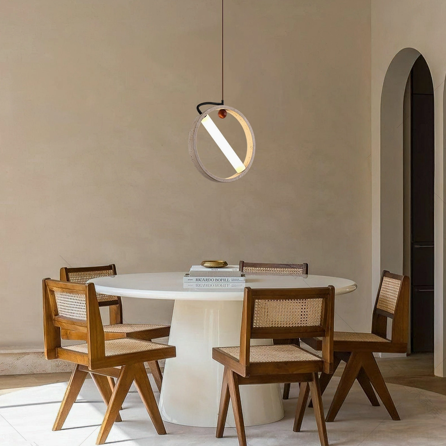 Orvion pendant light installed in Scandinavian modern dining room creating warm ambient glow above dining table