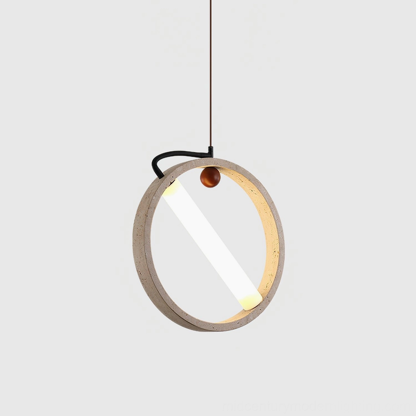 Orvion travertine ring pendant light overhead view showing circular geometric form and light distribution