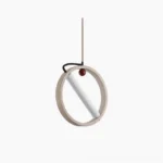Orvion minimalist travertine ring pendant light front view showing hollow circular stone frame with suspended LED core