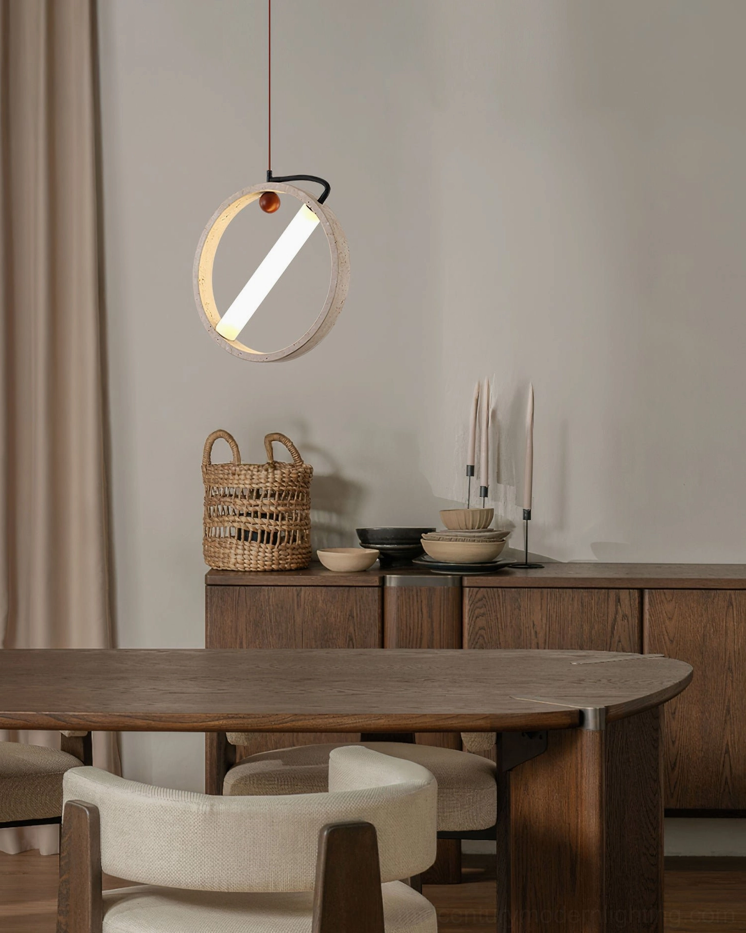 Orvion pendant lamp side view in dining area with warm walnut wood cabinetry showing geometric ring form