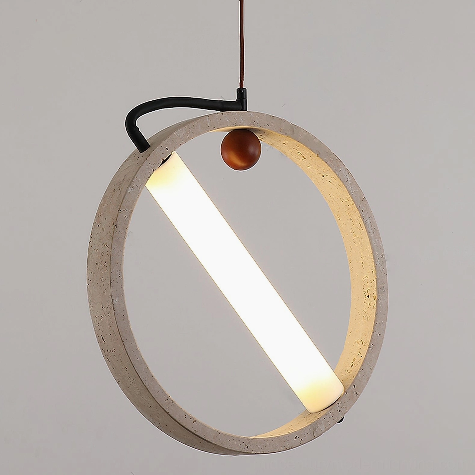 Orvion travertine pendant light detailed view of natural stone pitting and geometric suspended design