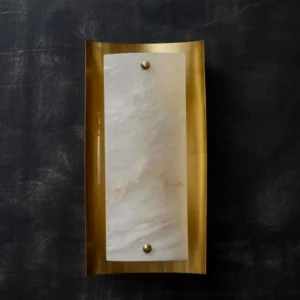 Osman Alabaster Wall Lamp mounted on dark textured wall showing curved brass frame detail and mounting hardware