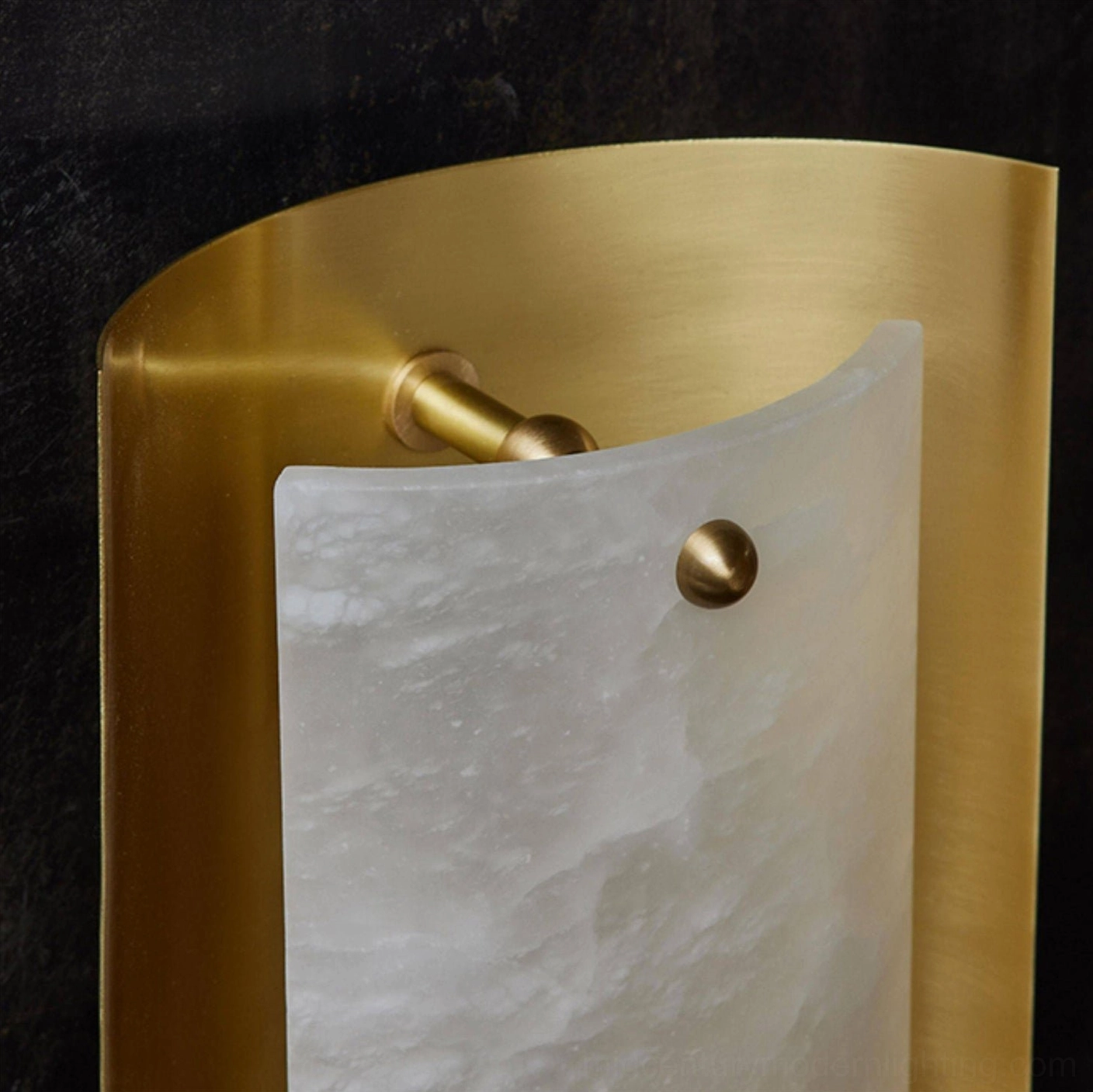 Side angle close-up of Osman Alabaster Wall Sconce showing brass fasteners and frame construction detail