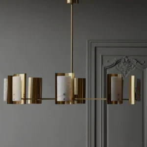 Osman alabaster brass chandelier in neoclassical interior, side eye-level perspective showing warm translucent stone glow, classic architectural setting