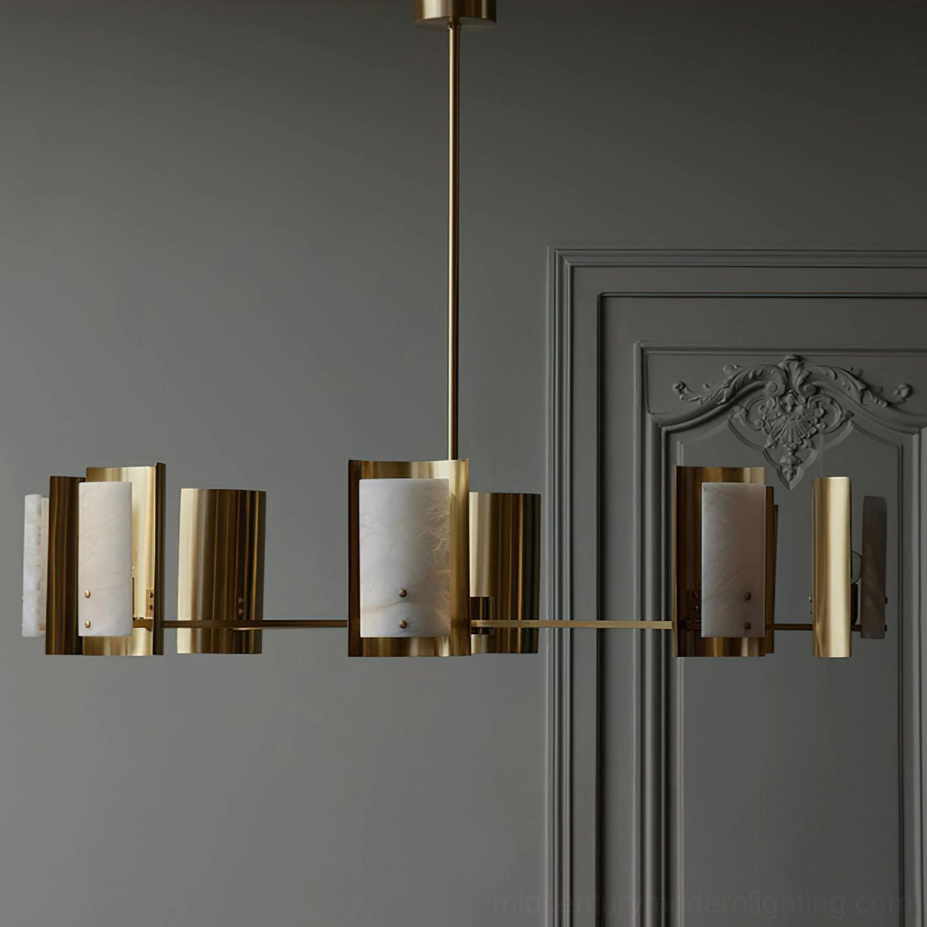 Osman alabaster brass chandelier in neoclassical interior, side eye-level perspective showing warm translucent stone glow, classic architectural setting