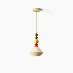 Otello stacked sphere pendant light with cream conical shade and colorful wooden beads in studio view