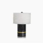 Outela modern table lamp with black marble base and corrugated alabaster shade, front studio view