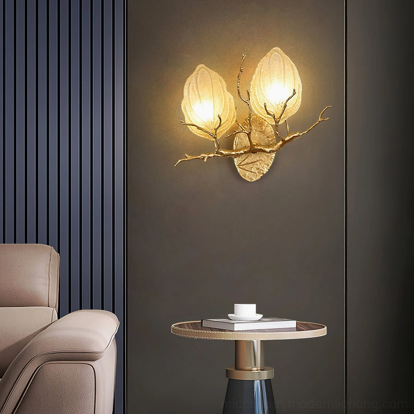 Outono Ficus wall sconce installed in modern living room above sofa, warm ambient lighting