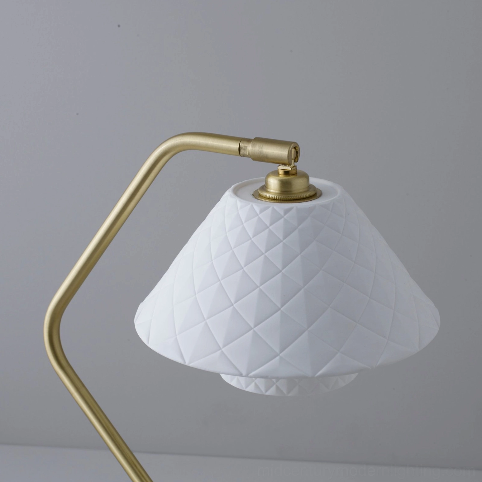 Oxford dual-shade lamp front view highlighting polished bone china quilted shades and satin brass frame details
