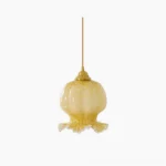 Ozera amber glass pendant light with ruffled scalloped edges and brass fixture, frontal view on white background