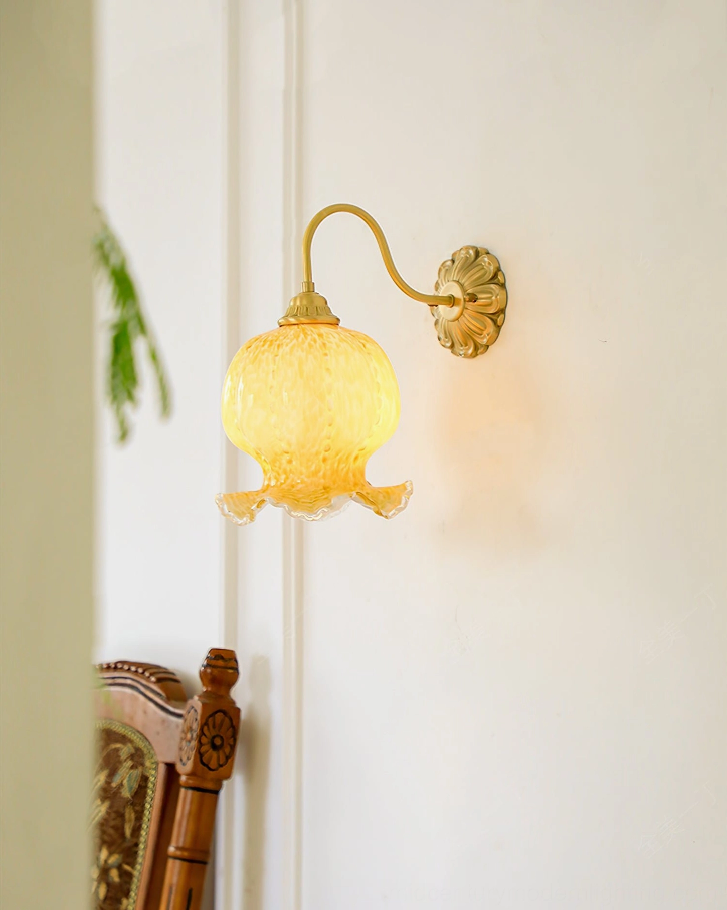 Ozera vintage wall lamp mounted on wall with ruffled glass and warm glowing light