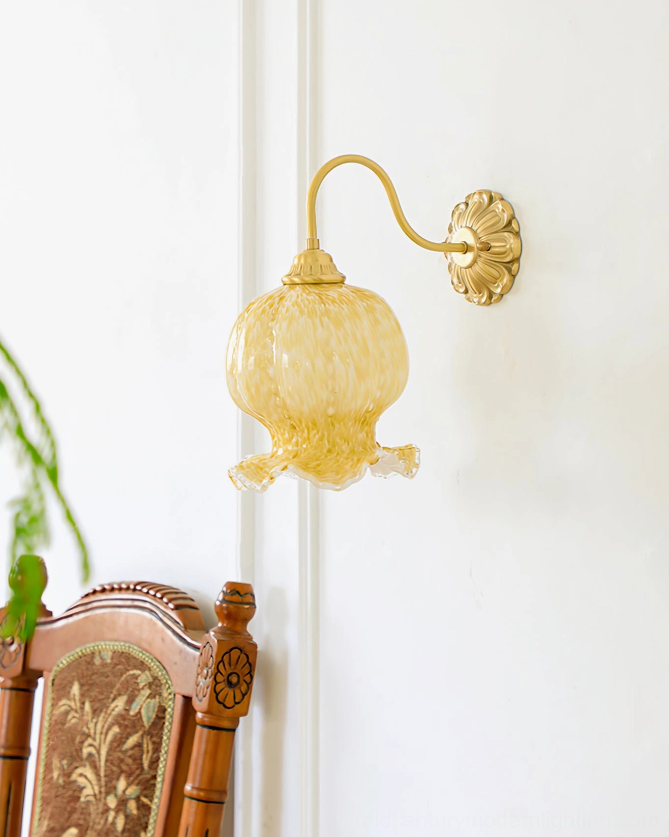 Ozera vintage wall lamp side view with flower-shaped brass hardware in home setting