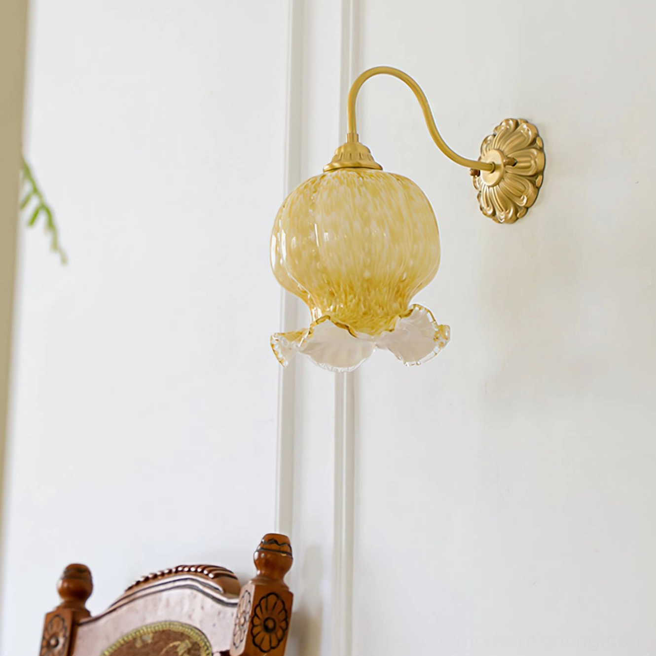 Ozera vintage wall lamp three-quarter view in French style interior with carved brass mount