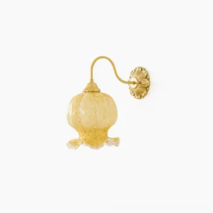Ozera brass wall sconce with amber spotted glass shade front view on white background
