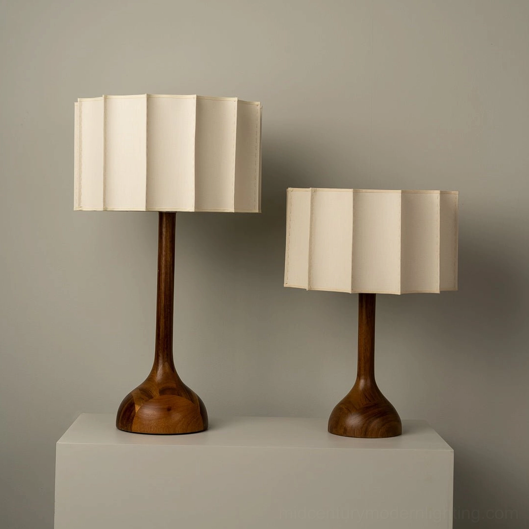 Two matching Sierra mid-century modern table lamps with wooden bases and pleated shades in symmetrical pair