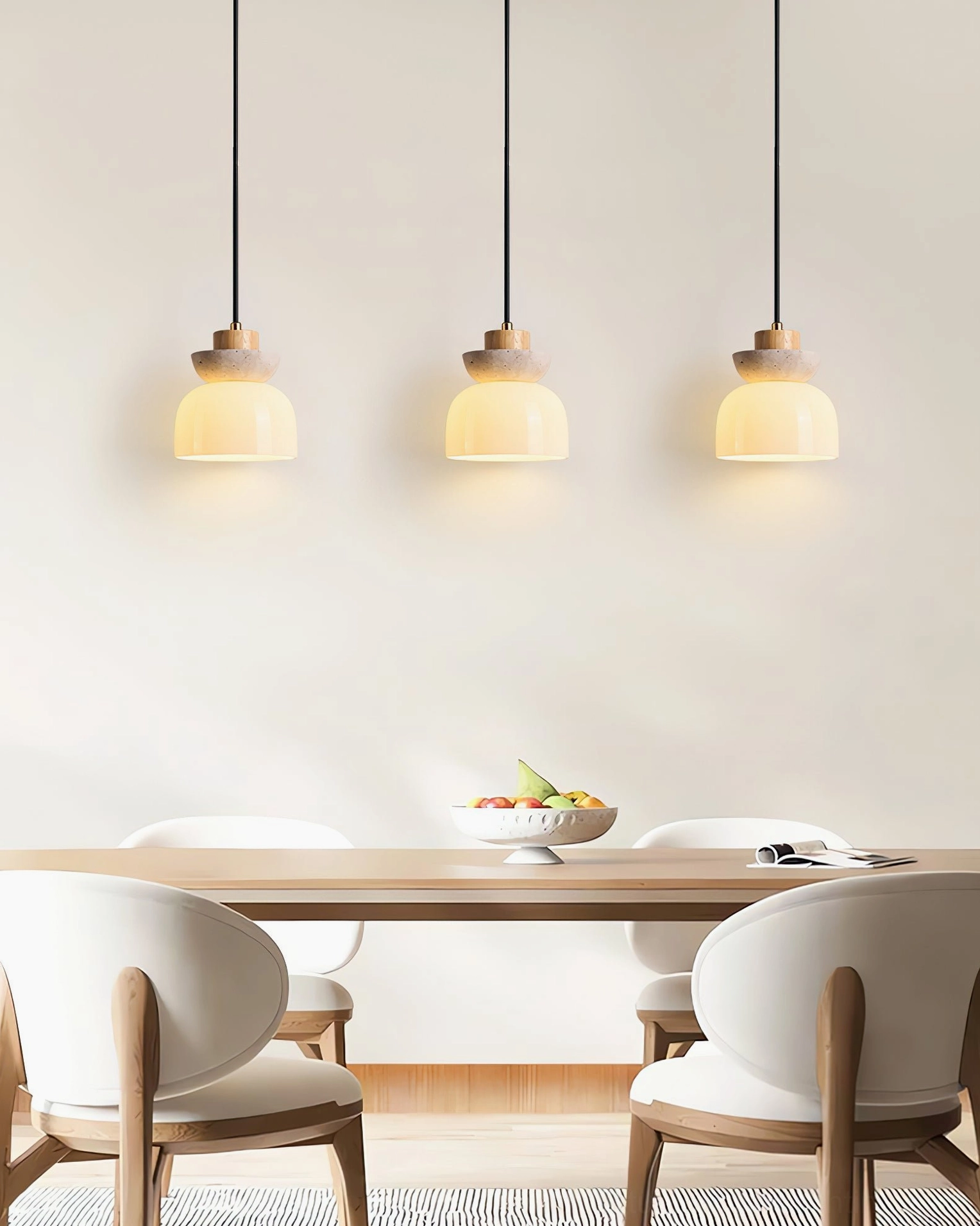 Three Palak pendant lights in minimalist dining area evenly spaced clean neutral aesthetic modern lighting