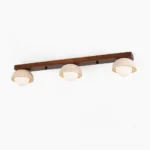 Palermo 3-head linear ceiling light with travertine domes and wood beam, front view on white background
