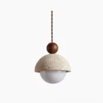 Palermo travertine pendant light with glass globe and wooden accent, direct studio view