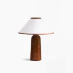 Palisades mid-century modern table lamp with brown ribbed wood base and white conical fabric shade, studio front view